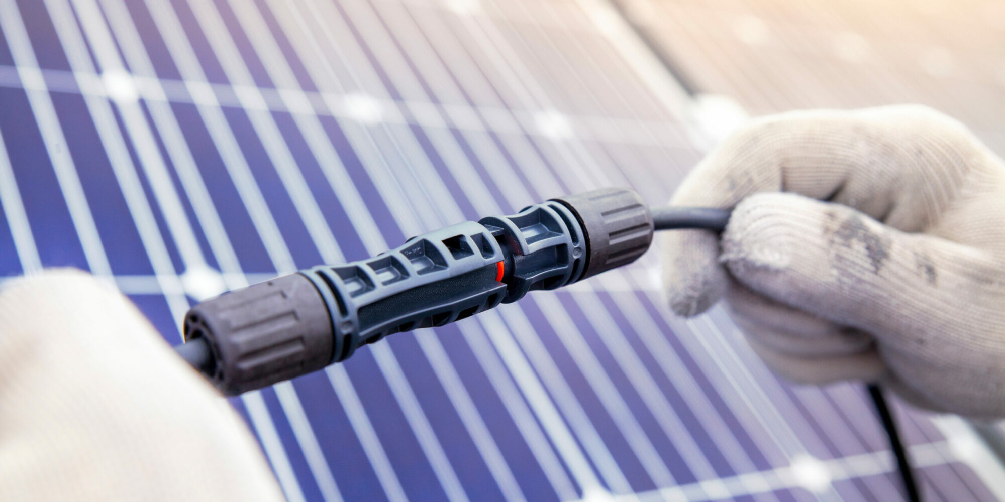 Technician Connecting the electric wire from solar panels genera Technician Connecting the electric wire from solar panels genera